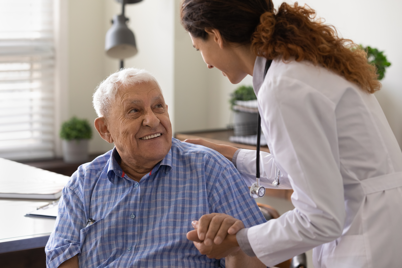 pharmacist with older male patient