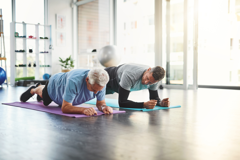 trainer and client doing the plank exercise