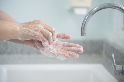 close up washing hands