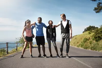 running club on road together